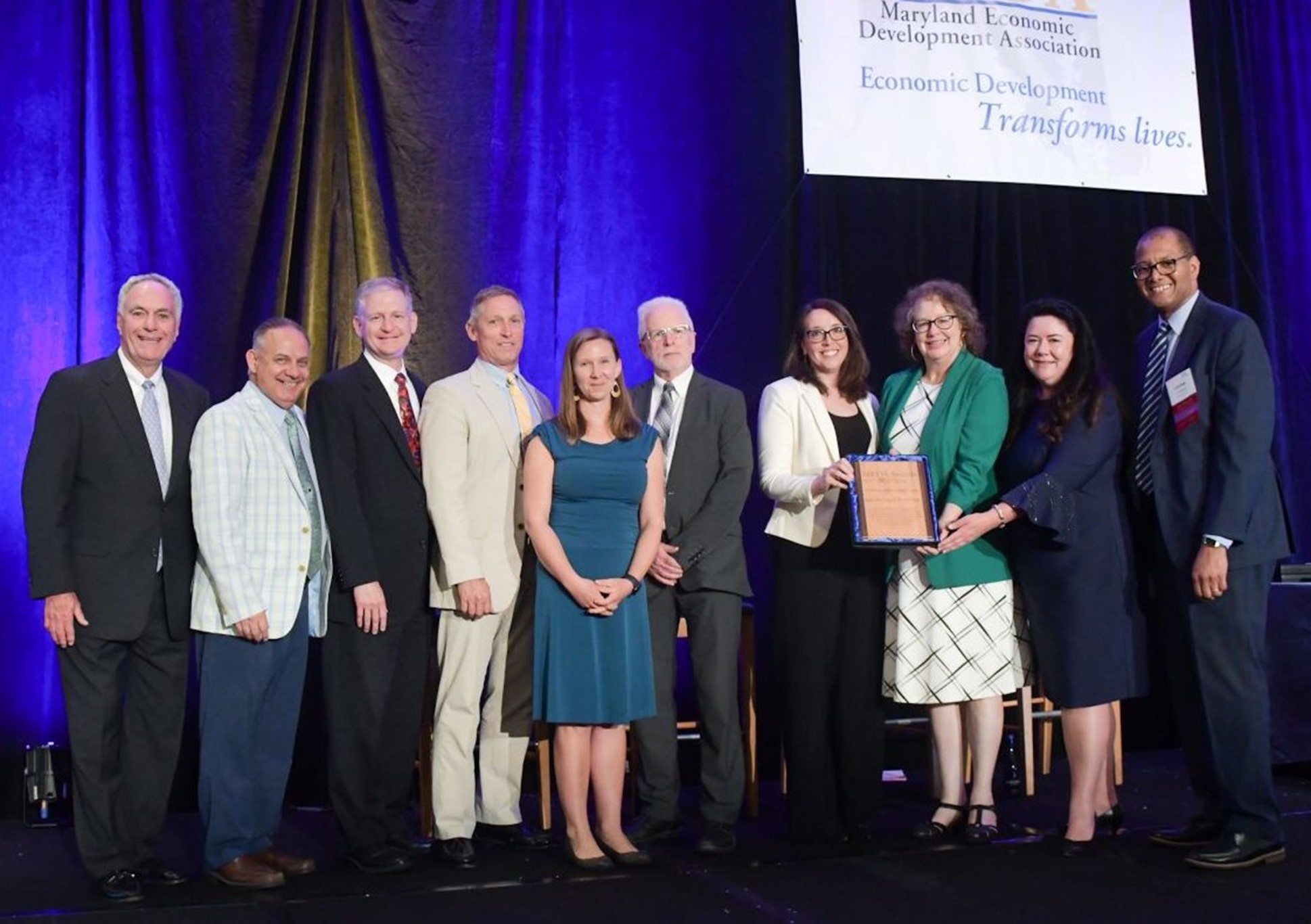 The Eastern Shore Economic Recovery Project Team receives the 2022 Maryland Economic Development Association (MEDA) Award. Pictured are John Wasilisin, Danny Thompson, Scott Warner, Greg Padgham, Erin Silva, Dan McDermott, Susan Banks, Debbie Bowden, Cassandra Vanhooser and Gordon Knox. Photo by Rick Lippenholz.