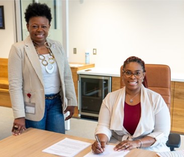 Debra Davis (left), pictured here with an EDCKC RLF borrower, participated in the Equitable Lending Leaders program.
