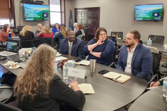 People talking at a table at the Economic Recovery & Resilience Community Conversation. E. Kentucky, March 30, 2023.